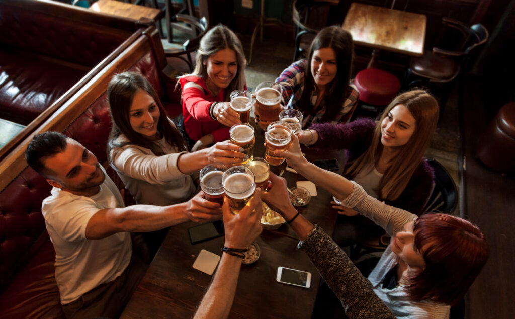 people having drinks at a delicious irish pub.