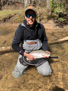 A veteran catching a fish having a lot of fun.