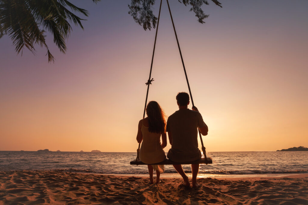 honeymoon travel, silhouette of romantic couple on sunset beach, tropical holidays near the sea, man and woman together on vacation